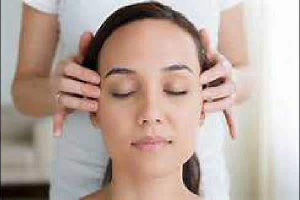 Woman having a Indian Head massage